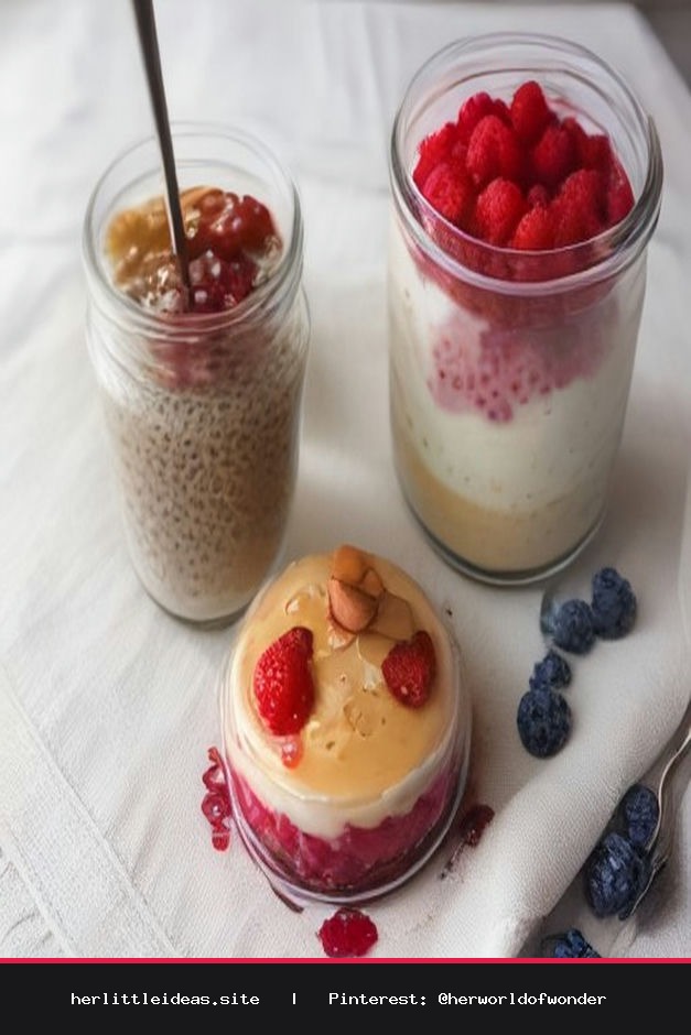 Two glass jars containing overnight chia seed pudding topped with fresh berries, sitting on a linen cloth in soft natural light.