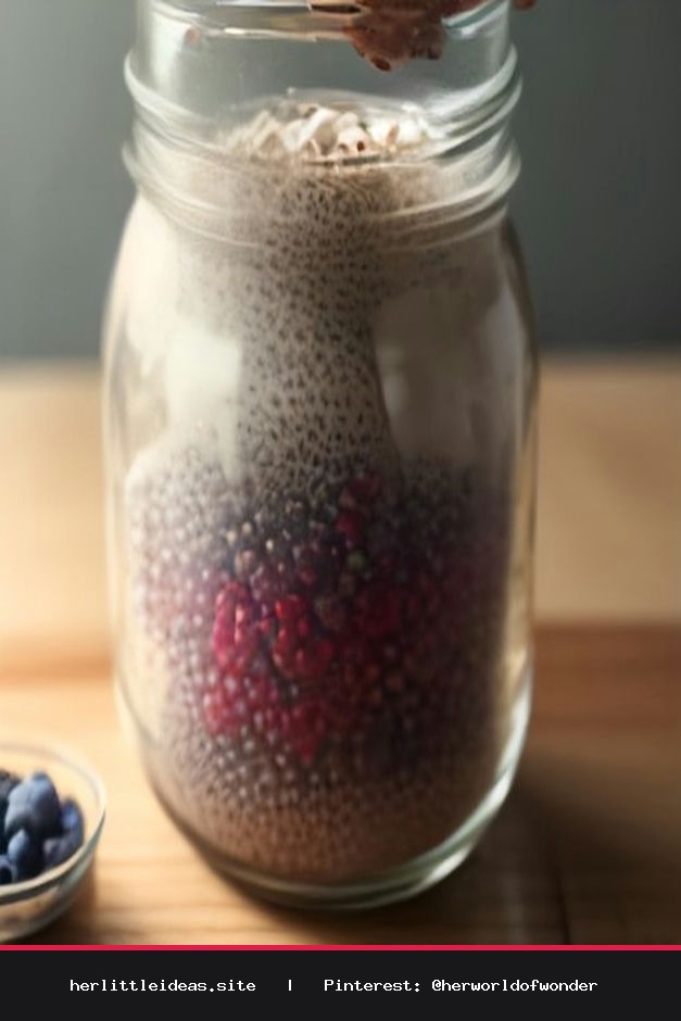 A glass jar of overnight chia pudding topped with fresh berries on a rustic wooden table.